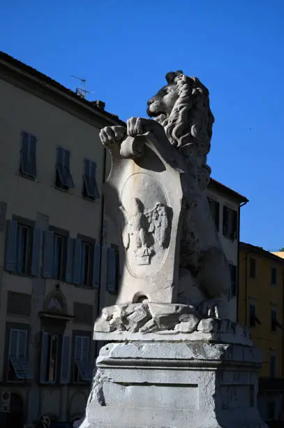 Lion statue on the Solferino bridge in the city of Pisa in Tuscany