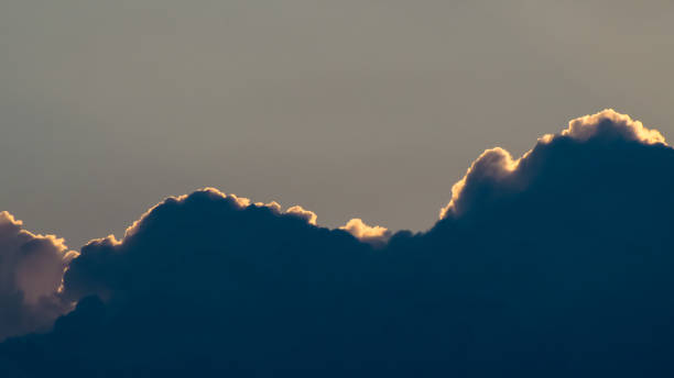 istock Cumulus silhouettes 1707639274