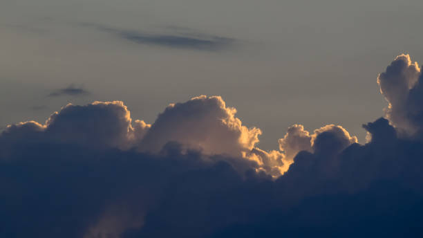 istock Cumulus silhouettes 1707639275