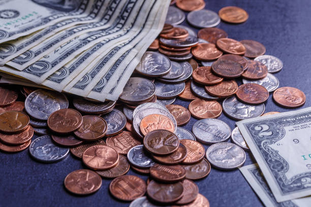 istock American coins and us dollars on a black table 1707642645