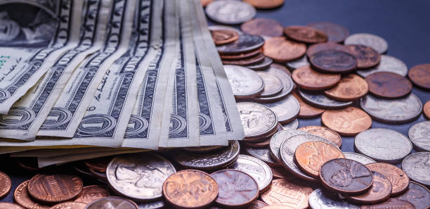 istock American coins and us dollars on a black table 1707642671