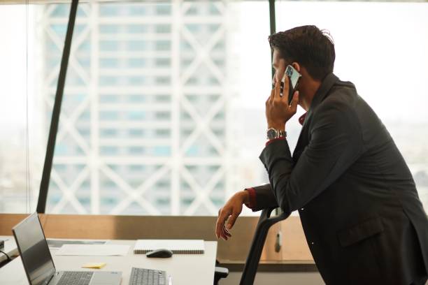 istock Corporate Connectivity: Businessman Engaged with Smartphone in Office 1707657986