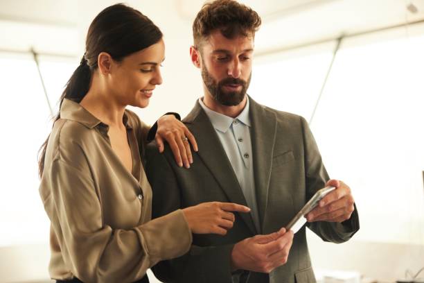 istock Office Discussion: Corporate Workers Engaged in One-on-One Meeting 1707659643