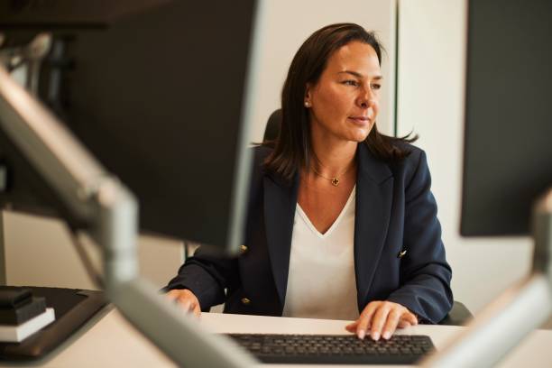 istock Dedicated Businesswoman Concentrating on Computer Work 1707666714