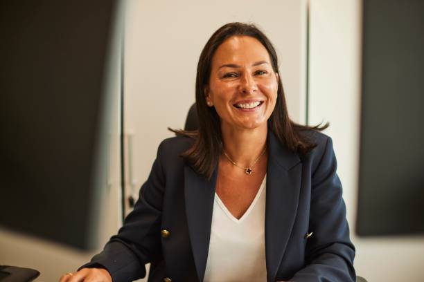 istock Businesswoman Exuding Confidence with a Broad Smile in Office Setting 1707666715