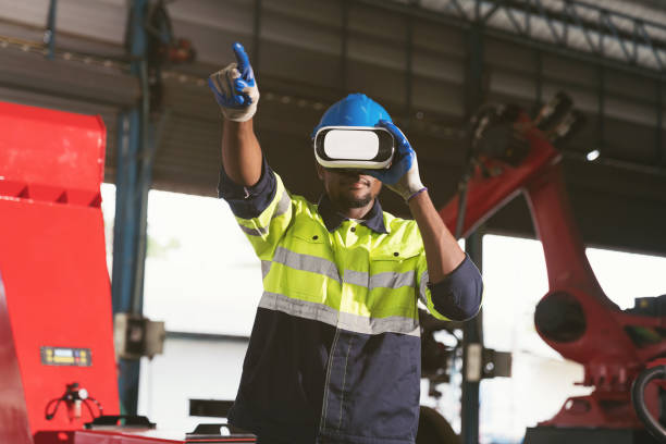 istock Male factory using virtual reality headset. Male engineer working and using virtual reality headset for control robot arm system welding at production plant factory 1707672633