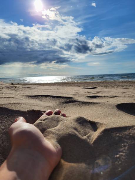 istock Sand in a human hand, sand beach and Baltic sea. 1707673190
