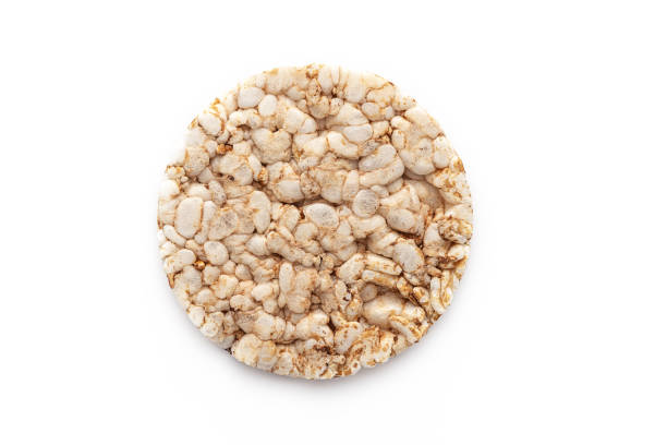 istock Puffed rice cake chips from above isolated on white background, Healthy snack. 1707717505