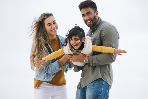 Airplane, sky background or child with parents playing for a family bond with love, smile or care. Mom, flying or happy Indian dad with a girl kid to enjoy fun outdoor games on a holiday together