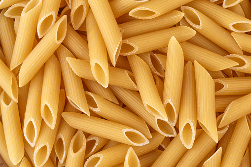 Macaroni, pasta, made by durum wheat.Pasta background. Testure for design.