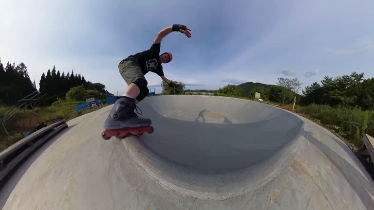 Free style inline skater doing tricks at skate park