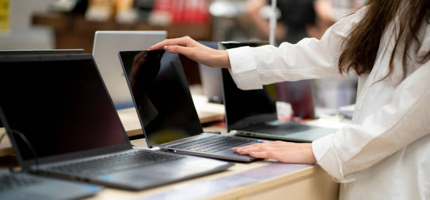 istock client in a retail shop choosing a new laptop for studying and working 1707735950