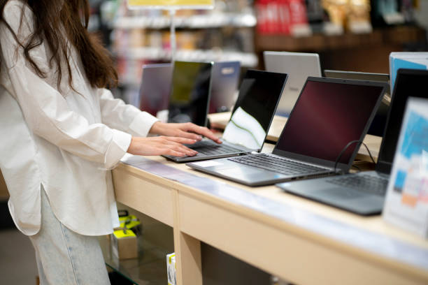 istock client in a retail shop choosing a new laptop for studying and working 1707735970