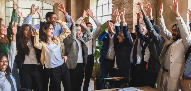 istock Multiracial business people celebrating together inside modern office - Teamwork and meeting concept - Soft focus on center hands 1707757848