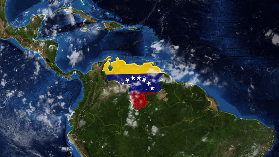 Credit: https://www.nasa.gov/topics/earth/images\n\nAn illustrative stock image showcasing the distinctive tricolor flag of Venezuela beautifully draped across a detailed map of the country, symbolizing the rich history and culture