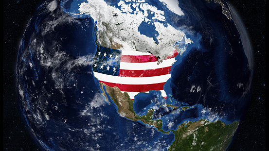 Credit: https://www.nasa.gov/topics/earth/images\n\nAn illustrative stock image showcasing the distinctive tricolor flag of United States beautifully draped across a detailed map of the country, symbolizing the rich history and culture