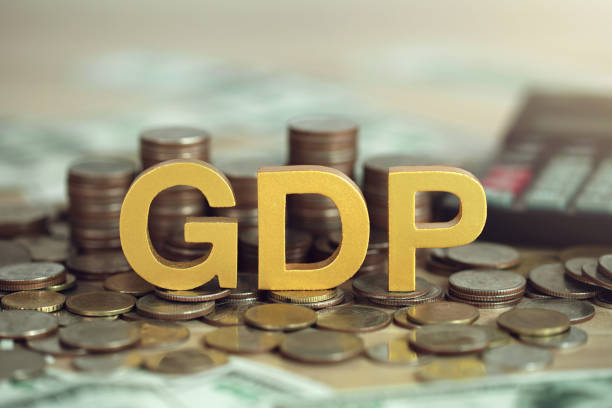 istock Gross domestic product concept.GDP Text on the Coins stack and calculator on the table. monetary policy, Financial, Management, Economic, Inflation, Business and growth of GDP 1707763964
