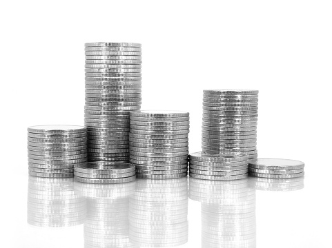 Pile of silver coins isolated on white background. Silver empty coins stack.