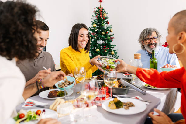 istock Happy multi generational family enjoying christmas dinner at home 1707765094