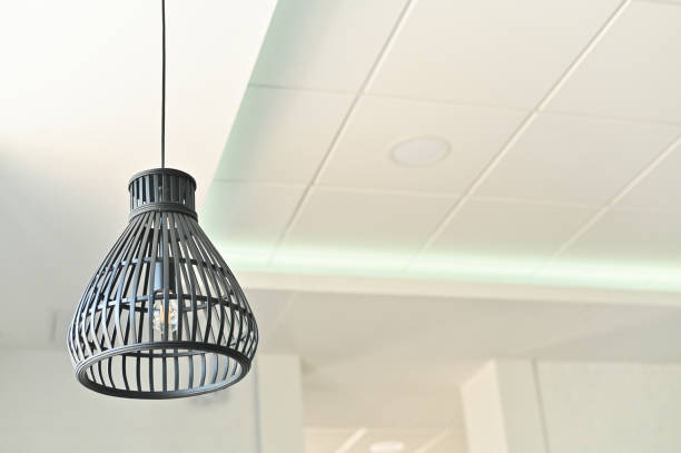 istock Lamps on long wires in front in a bright interior, elements of lighting and interior design. 1707771690