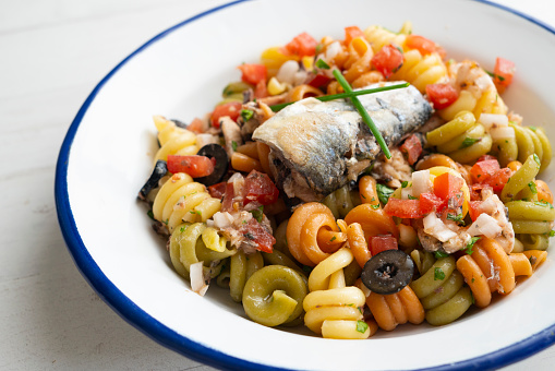 Fresh pasta with vegetables and sardines..