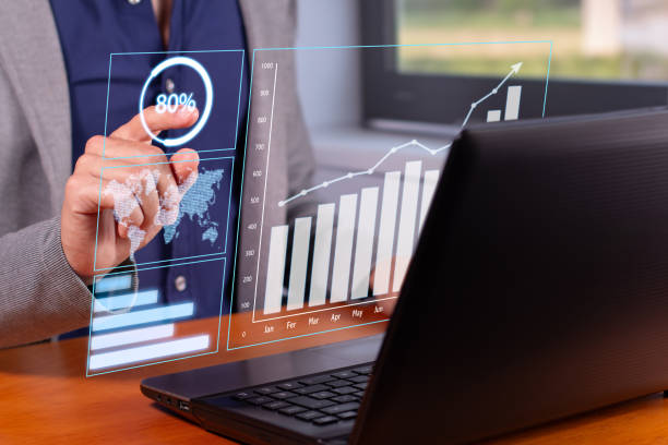 istock Successful Business Trends: Businessman Analyzing Rising Graphs in Modern Office 1707794284