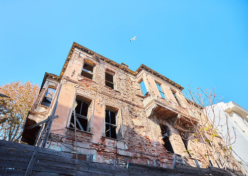 Istanbul, Turkey - November 22, 2021: An old ruined house of ancient architecture in the center of Istanbul in the Fatih district.