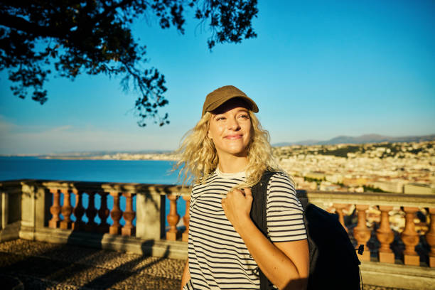 Young woman enjoying her time on vacation in Nice, France on the French Riviera stock photo