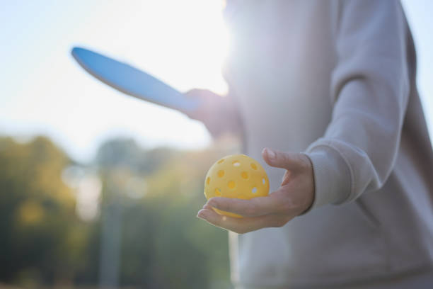 istock Pickleball athlete serving a ball with a racket 1707854238