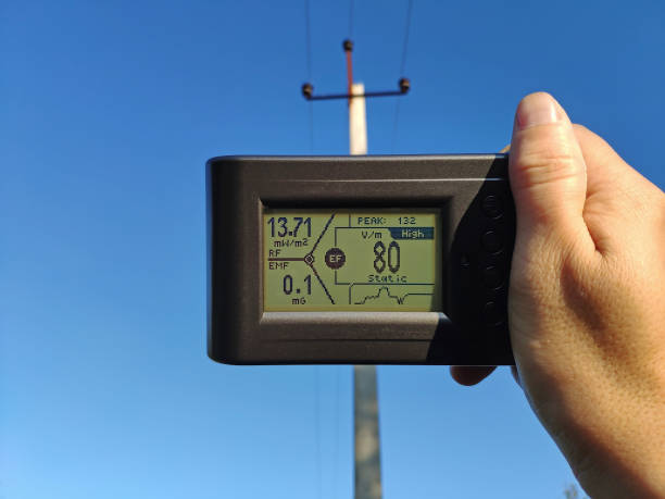 istock Measuring the electric field strength from a power line. Measuring electronic device in the hand 1707854776