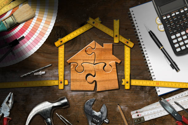 istock Home Improvement Concept - Work Tools and Wooden Model House 1707858598