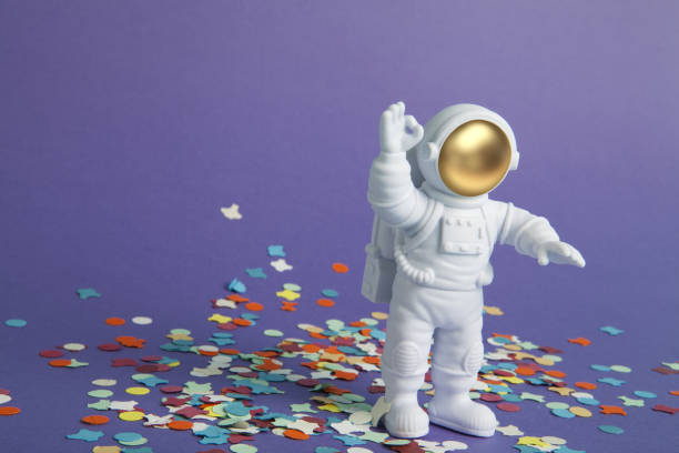 istock an astronaut figurine in a spacesuit on a confetti carpet 1707868018