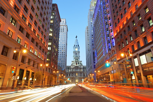 Philadelphia, Pennsylvania, USA cityscape on Broad Street with City Hall at twilight.