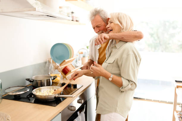 istock Carefree senior couple preparing lunch 1707901926