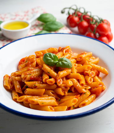 Italian macaroni with tomato and basil sauce.