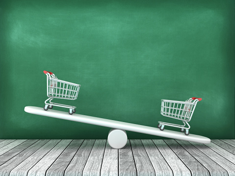 Shopping Carts on Seesaw - Chalkboard Background - 3D Rendering