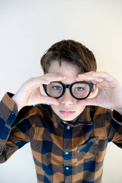 istock cool young boy wearing black glasses 1707968271