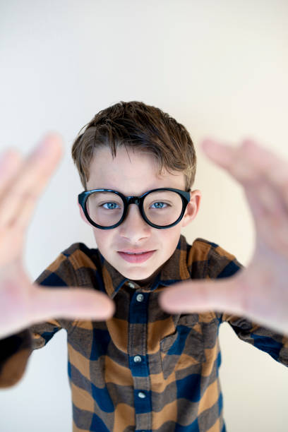 istock cool young boy wearing black glasses 1707968284