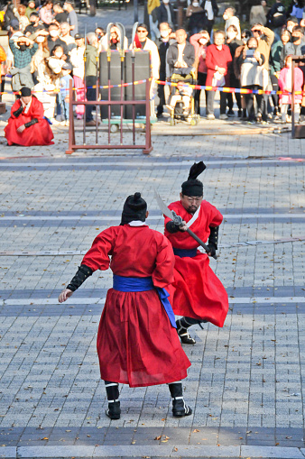 Seoul, South Korea - October: Traditional Korean Kingdom Soldier Warriors fight with long lance among tourists in Namsan Mountain