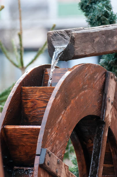 Water falling in the Water Mill Wheel on Blurred Background