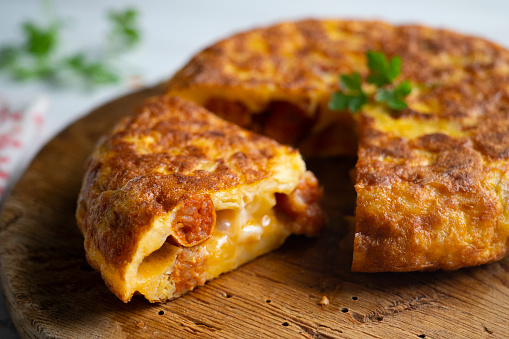 Spanish potato omelet with chistorra, a type of traditional chorizo ​​from the Basque country..