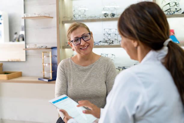 istock Woman visiting the optician for an eye exam 1708008388