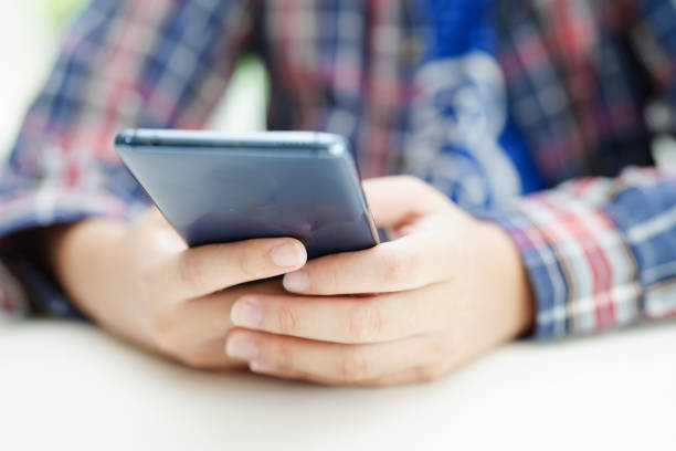 istock Asian teenage using mobile application in digital smartphone technology for learning. 1708019410