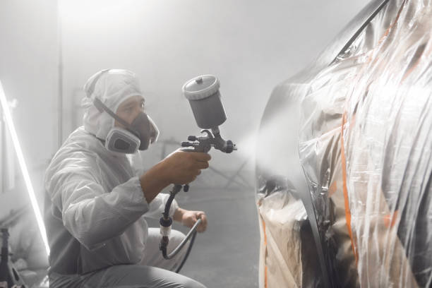 istock Spraying varnish paint to the car. Paint coating applying with ceramic coating. 1708051333