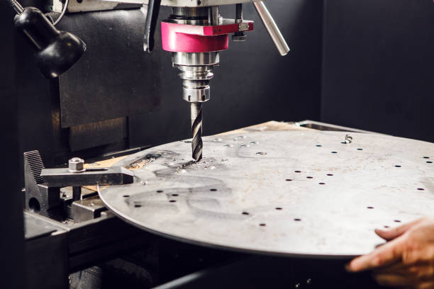 istock Drilling the under bolt hole. Vertical drill makes holes in metal part. 1708065977