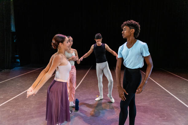 istock Young ballet dancers rehearsing before the performance at stage theater 1708087688