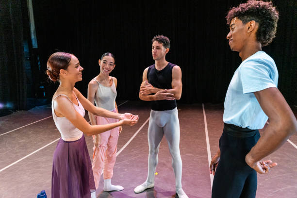 istock Young ballet dancers rehearsing before the performance at stage theater 1708088201