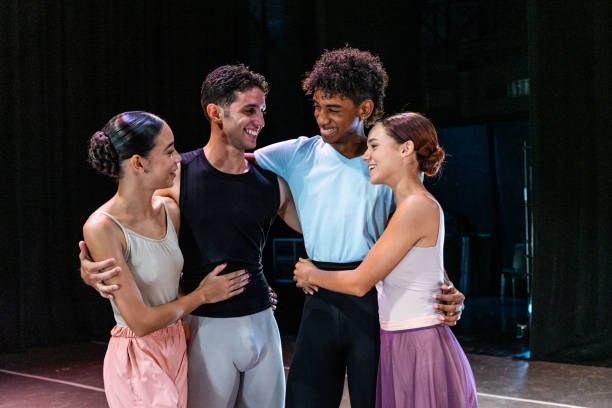 istock Ballet dancers couple embracing while talking at stage theater 1708088234