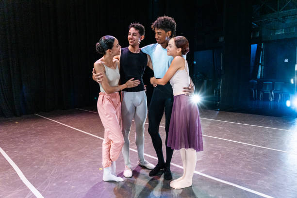 istock Ballet dancers couple embracing while talking at stage theater 1708088246