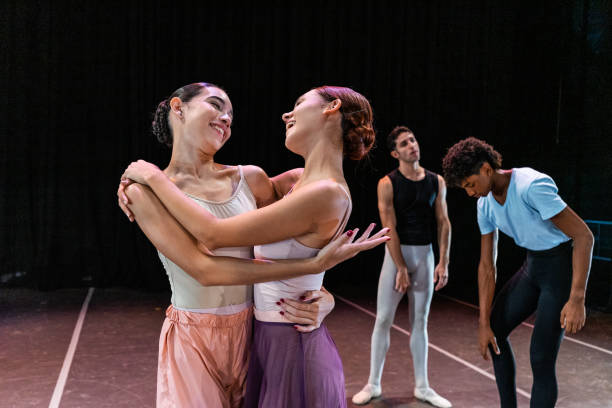 istock Ballerinas friends embracing while talking at stage theater 1708088763